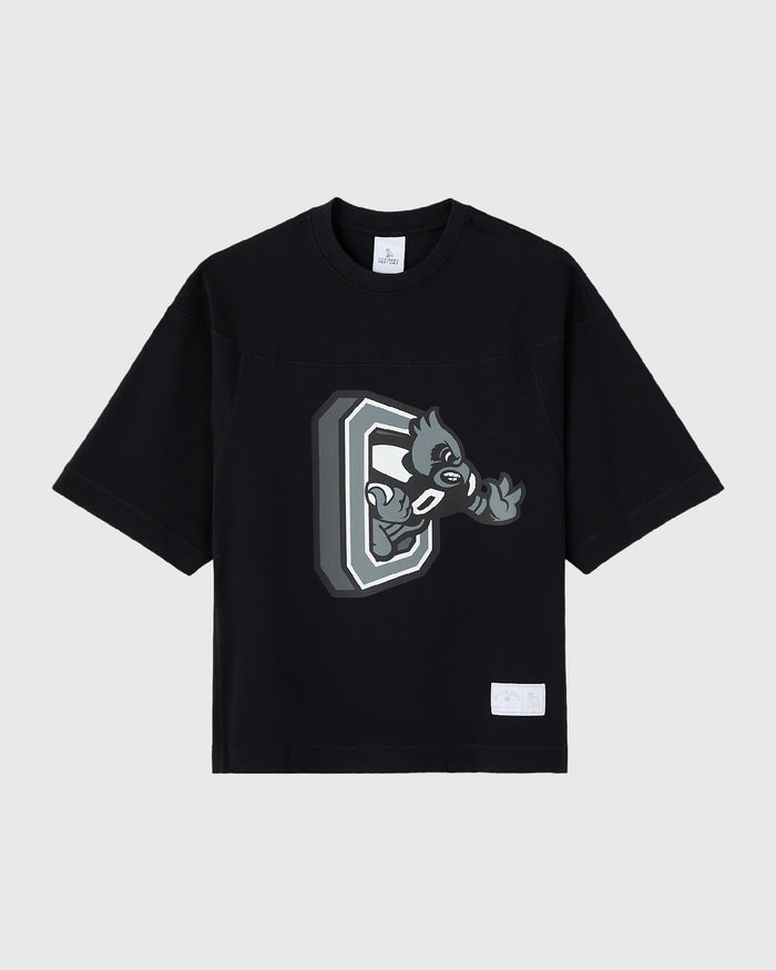 Black short-sleeve t-shirt with gray mascot character graphic on chest and small white label patch.
