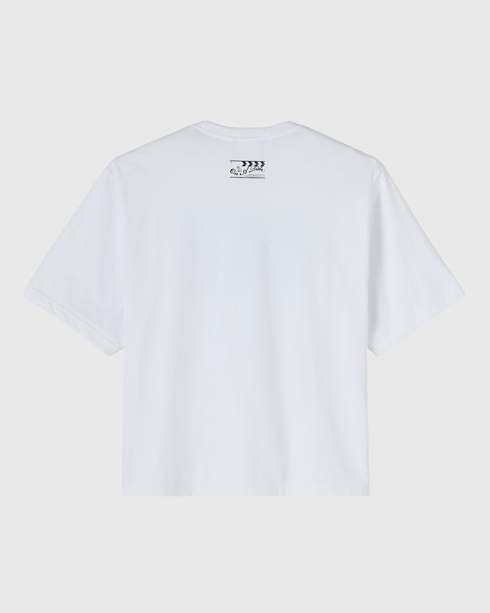White t-shirt with small clapper board graphic on upper back.