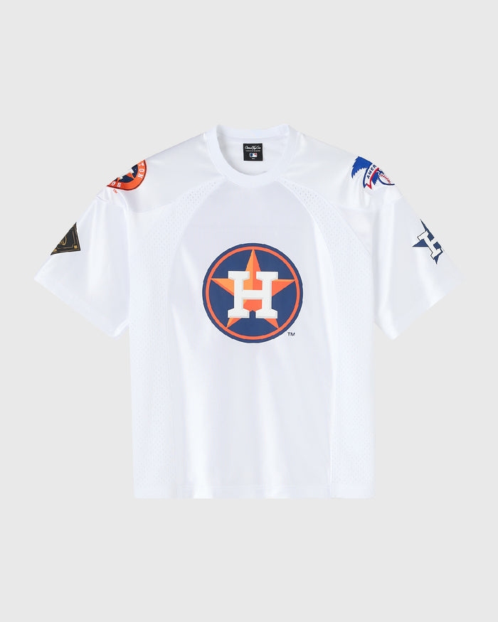 A white Houston Astros short-sleeve athletic jersey with a large circular team logo on the chest, displayed flat against a light gray background.