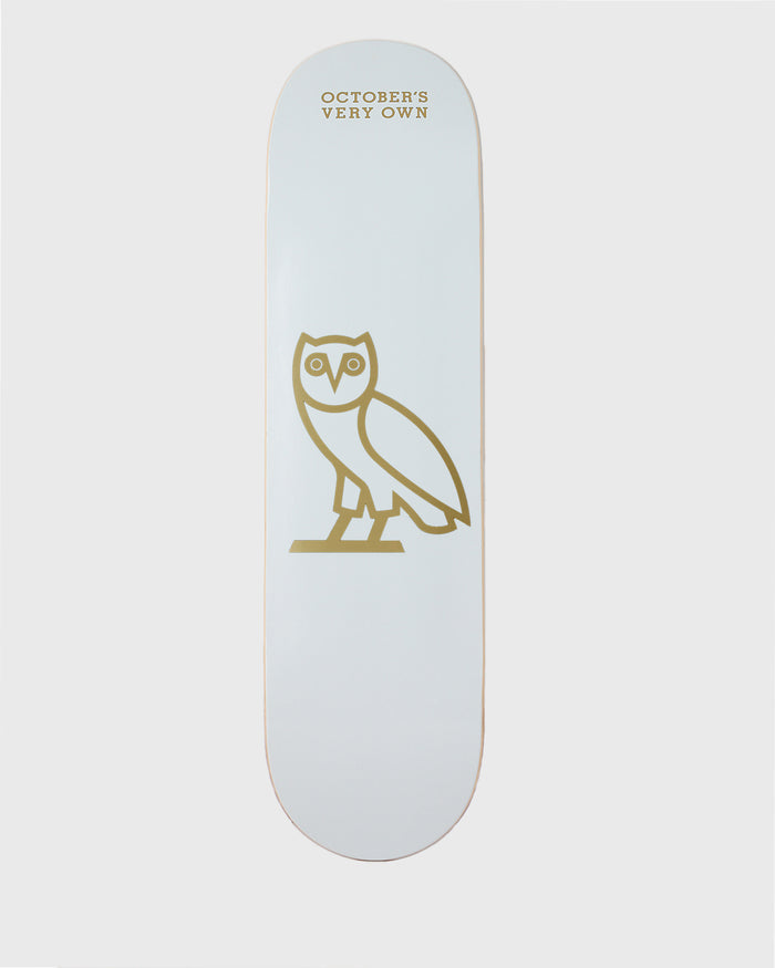 White skateboard deck with gold owl icon and "October's Very Own" text.