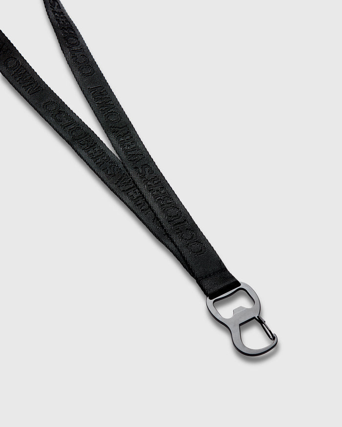 Black lanyard with woven texture and metal clip attachment at end.