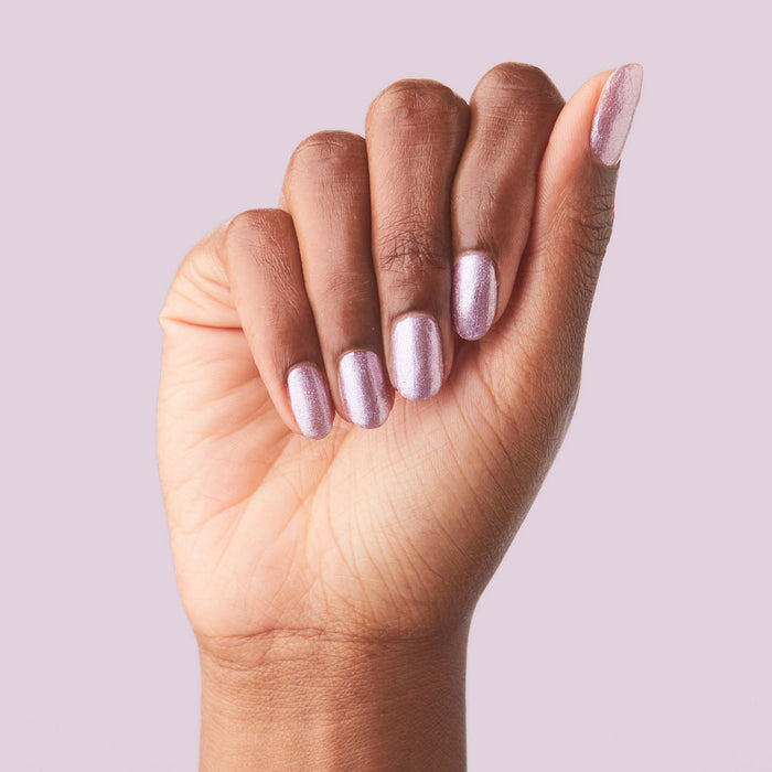 Hand with nails painted in metallic Lilac Shimmer nail polish for a soft and stylish at-home manicure look