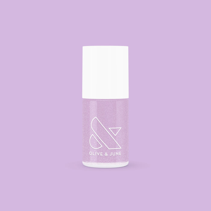 Bottle of Olive and June Lilac Shimmer polish showing a soft metallic lilac shade for at-home manicures and pedicures