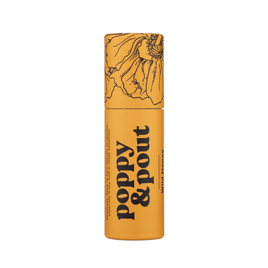 Wild honey lip balm tube, yellow barrel with floral illustration and black label text