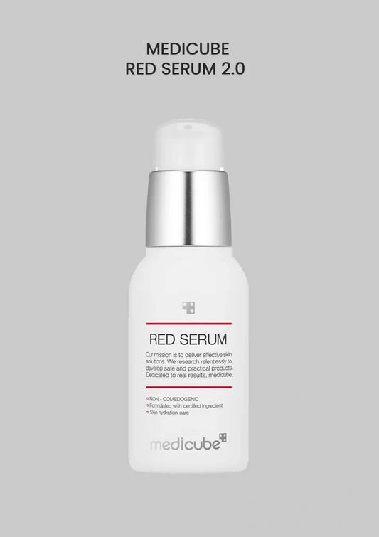 Medicube Red Serum 2.0 bottle on a gray background