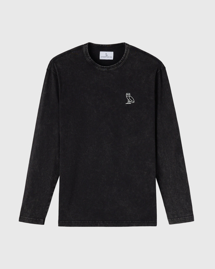 Black garment-dyed long-sleeve tee with small owl embroidery on chest and crew neckline.