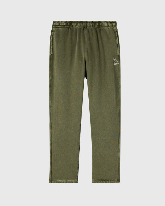 Cypress green sweatpant with elastic waistband, open hem, side pockets, and small owl emblem on thigh.