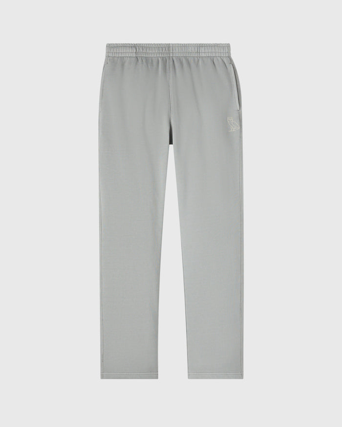 Gray sweatpants with elastic waistband, side seams, open hem, and small embroidered logo on thigh.