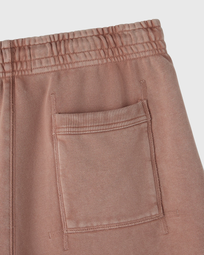 Clay pink sweatshort with elastic waistband and patch pocket detail.