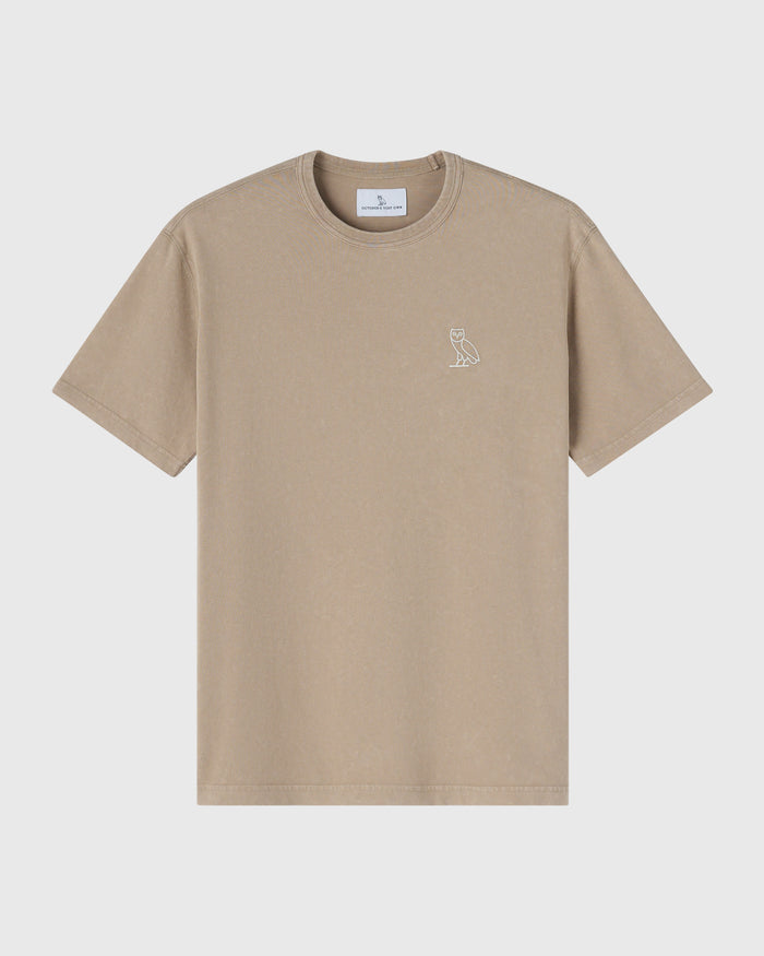 Sandstone-colored crewneck t-shirt with small owl emblem on chest.
