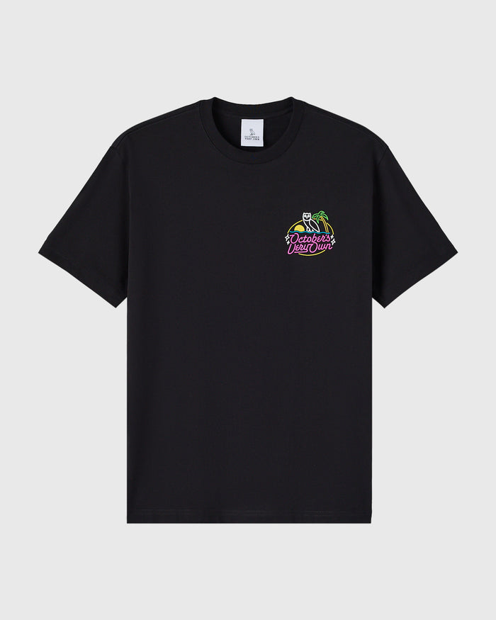 Black crewneck t-shirt with neon-colored graphic print on chest featuring skeleton and text design.