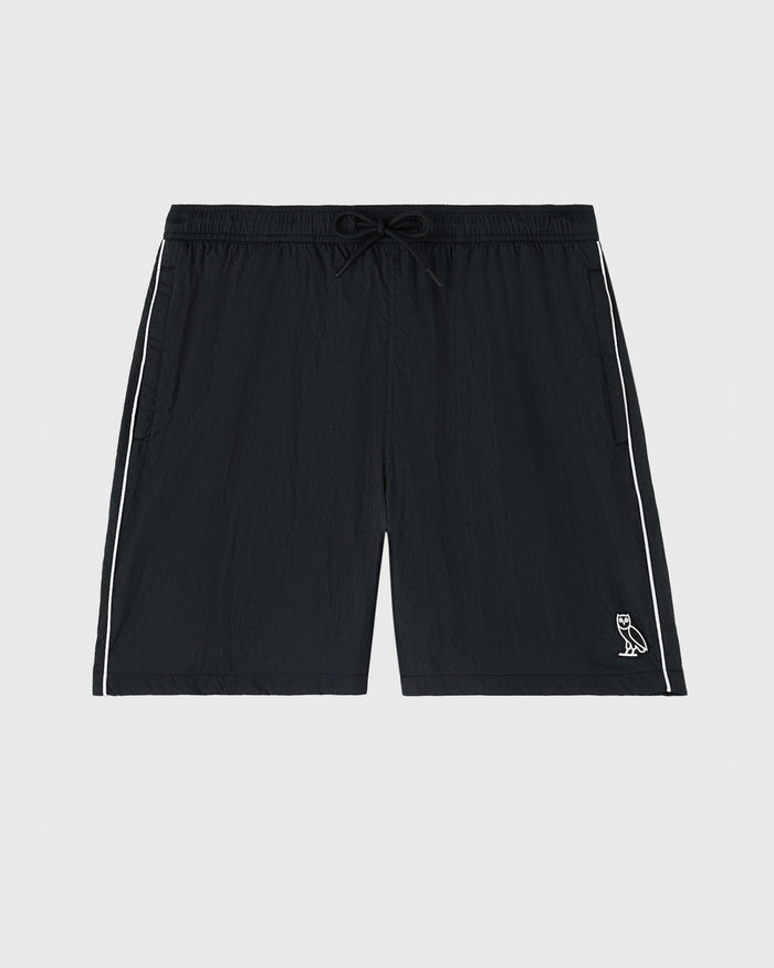 Black nylon track shorts with white side stripes, drawstring waistband, and small logo on right leg.