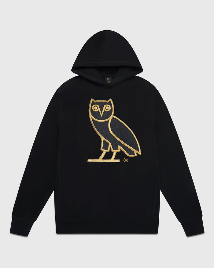 Black hoodie with gold owl graphic and registered trademark symbol on chest.