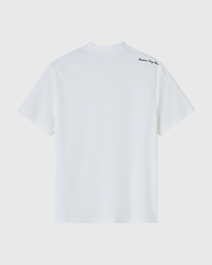 White mockneck golf tee with short sleeves and small text logo on upper chest.