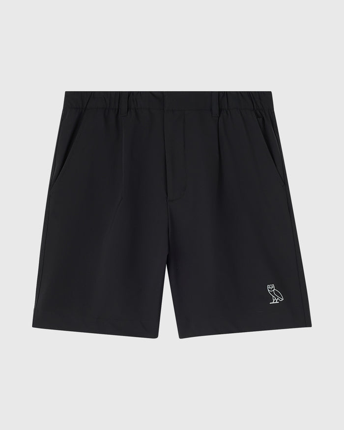 Black stretch nylon golf shorts with OVO owl logo embroidered on right leg.