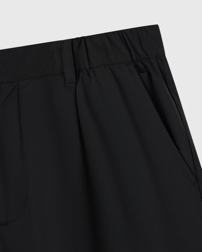 Black stretch nylon golf shorts with flat front waistband and side pockets.