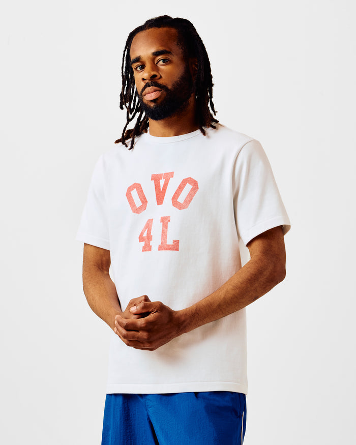 White t-shirt with red "OVO 4L" graphic print on chest, short sleeves, crew neckline.