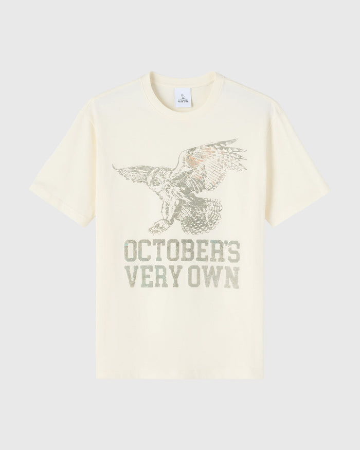 Cream t-shirt with textured owl graphic and "October's Very Own" text printed in gray.