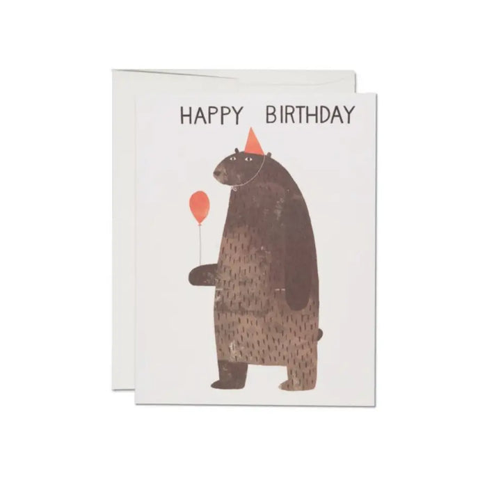 Birthday card with brown bear holding orange balloon and “HAPPY BIRTHDAY” text