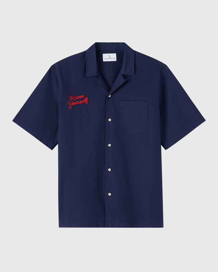 Navy camp shirt with short sleeves, button front, chest pocket, and red "Know Yourself" embroidery on the left chest.