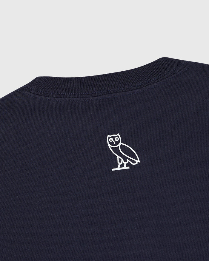 Navy blue t-shirt with small white owl outline graphic on chest.