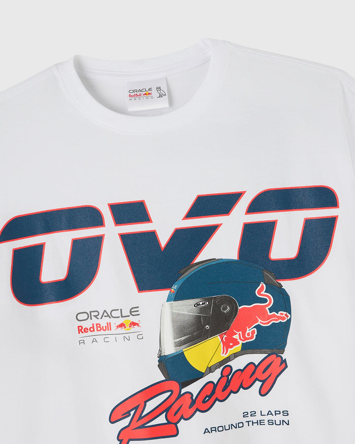 White t-shirt with Red Bull Racing logo, racing helmet graphic, and blue and red text design.