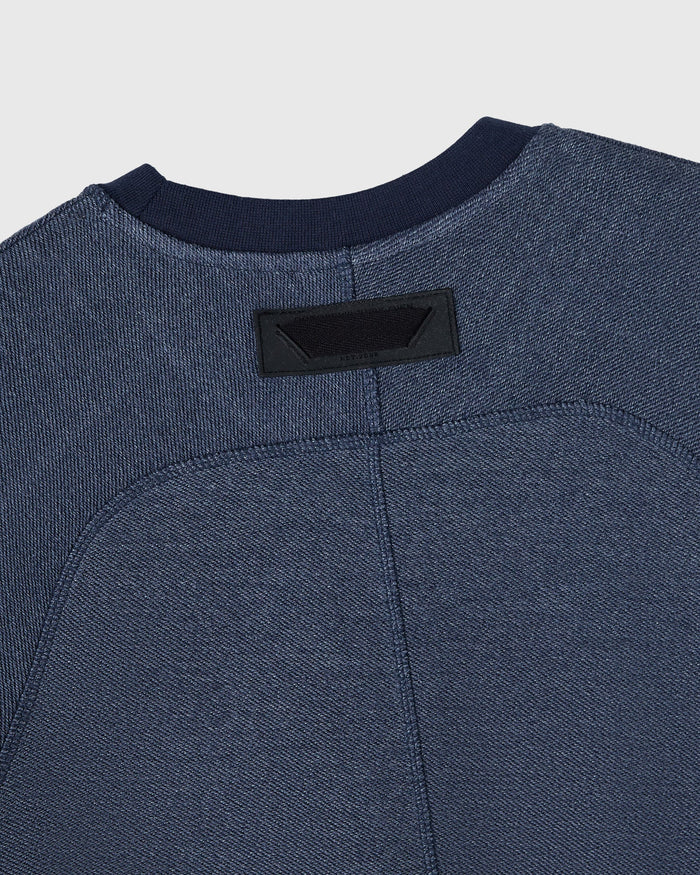 Royal navy crewneck sweatshirt with textured reverse french terry fabric and black neck label.