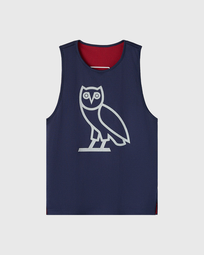 Reversible mesh basketball jersey with navy exterior featuring white owl graphic and deep red interior lining.