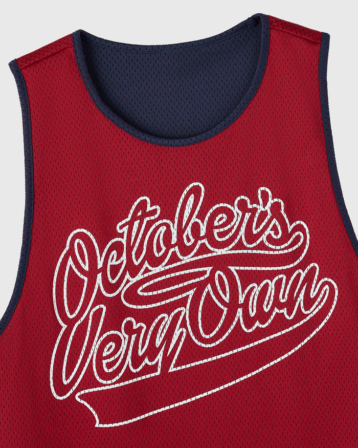 Reversible mesh basketball jersey with deep red side showing white "Odalberts Very Own" script graphic and navy blue interior