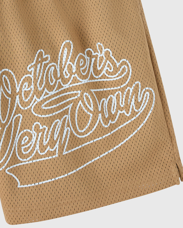 Camel mesh short with white embroidered script logo on front.