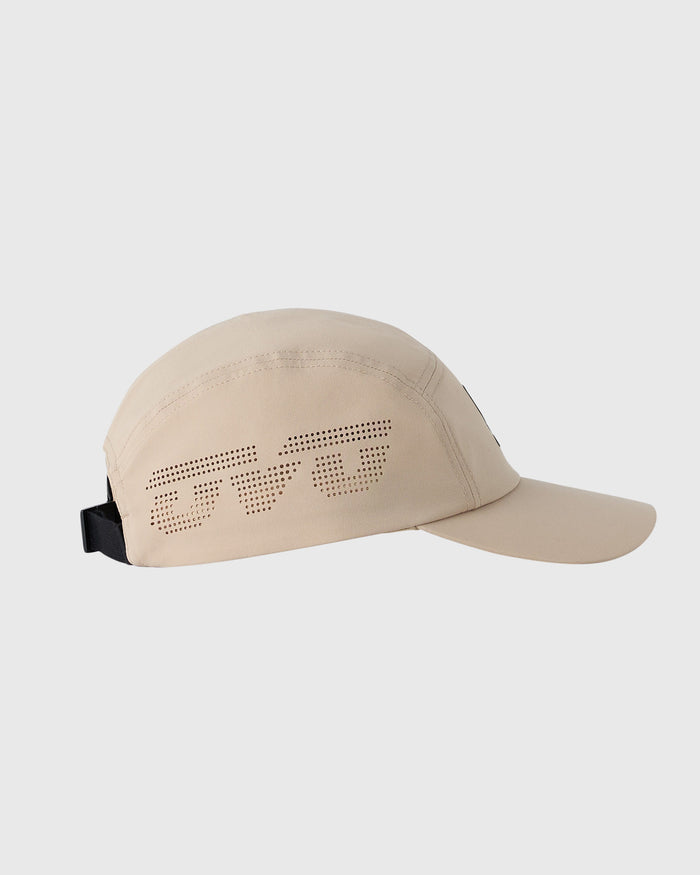Sandstone five-panel cap with perforated wing logo on crown and black back strap closure.