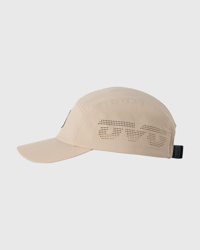 Sandstone five-panel cap with perforated text design and black back closure.