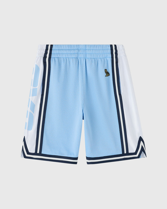 Light blue basketball shorts with white and navy side panels, elastic waistband, and mesh fabric.