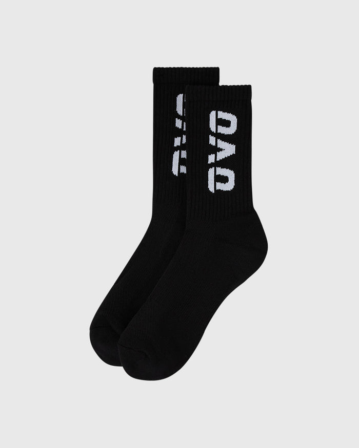 Pair of black crew socks with white text and geometric logo on the calf.