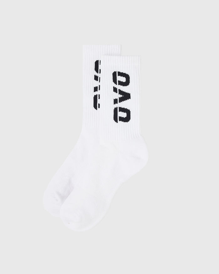 White crew socks with black text and ribbed fabric construction.