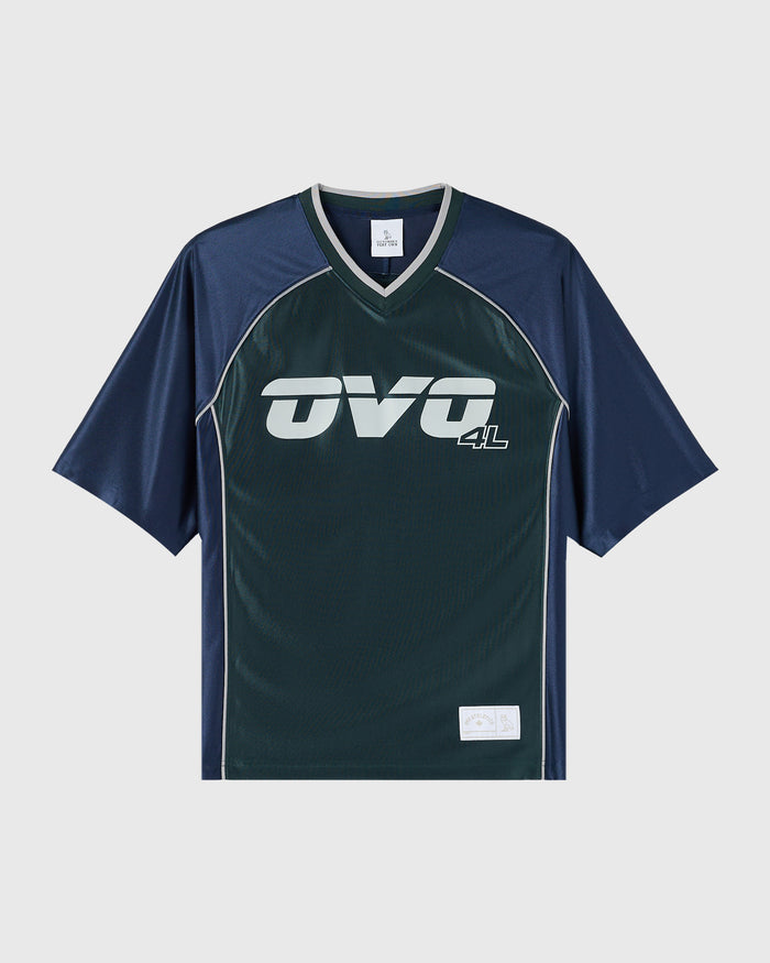 Midnight green and navy colorblock tee with white "OVQ 4L" logo and v-neckline.