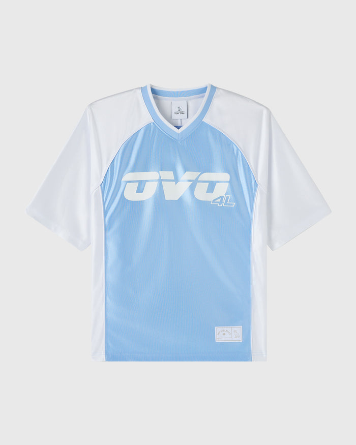 Light blue and white colorblock t-shirt with "ova 4L" logo on chest and small patch detail at bottom.
