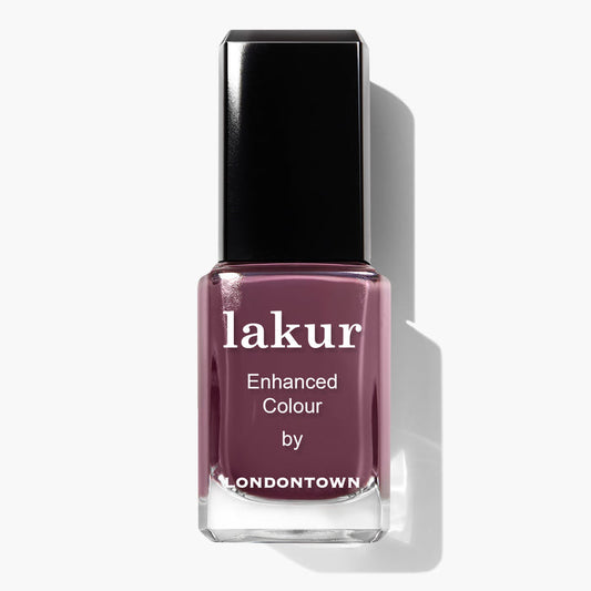 A bottle of Save the Queen Lakur Enhanced Colour nail polish by LONDONTOWN, featuring a dark mauve and plum shade with a black cap, infused with Florium Complex and proudly vegan and cruelty-free.