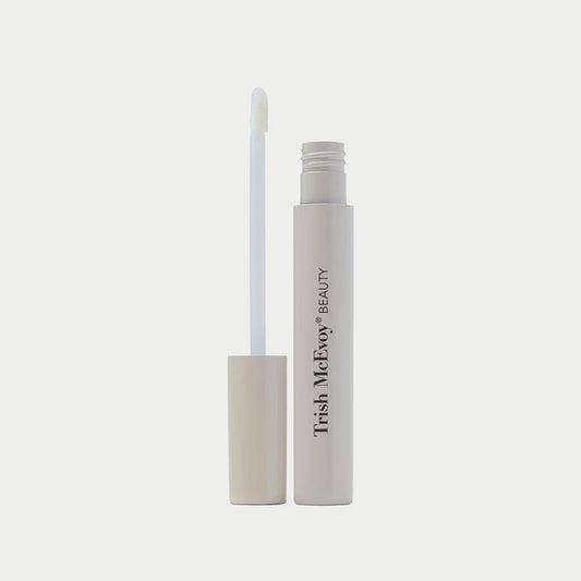 Trish McEvoy beauty product with applicator on a light gray background