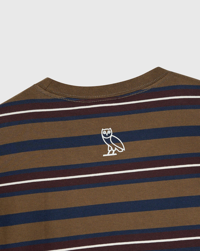 Moss-colored long-sleeve tee with horizontal stripes in navy, burgundy, and white, featuring white owl logo on chest.