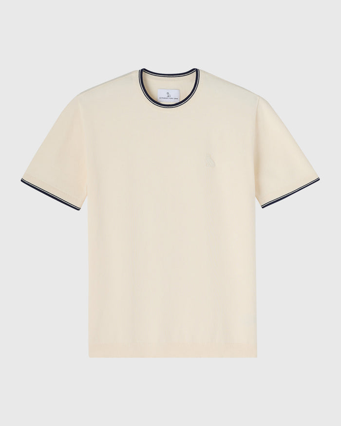 Cream short-sleeve sweater t-shirt with navy striped crew neckline and cuffs.