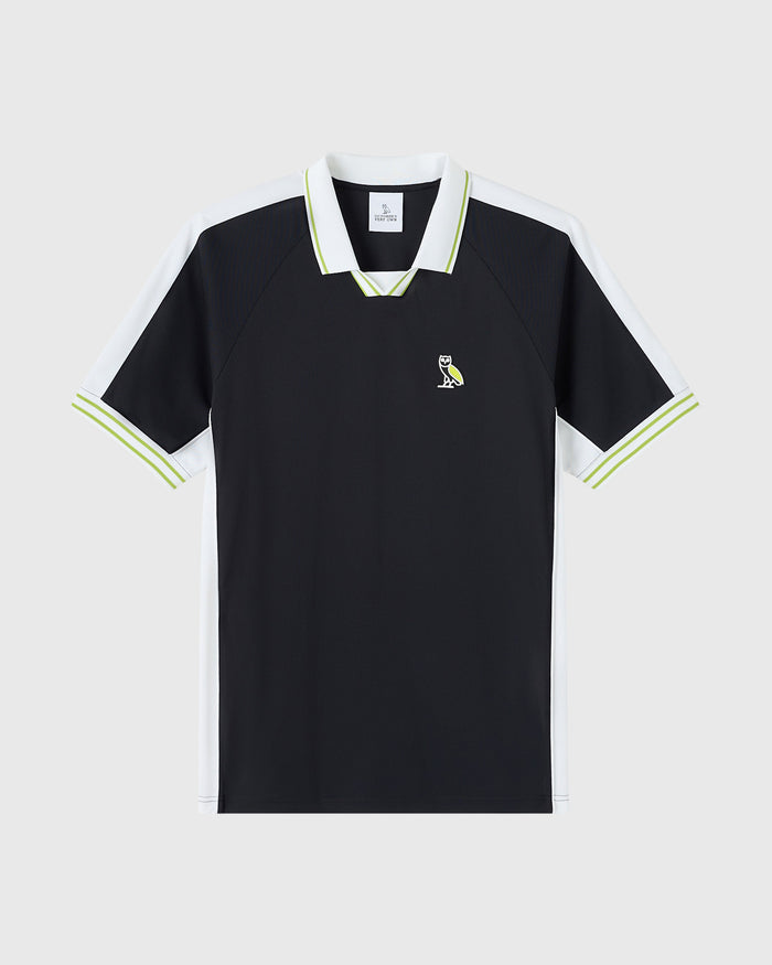 Black piqué polo shirt with white collar and lime-green trim, white side panels, and small owl emblem on chest.