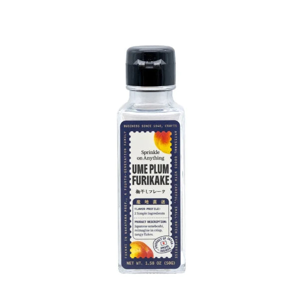 A bottle of Sprinkle on Anything Ume Plum Furikake seasoning, featuring a clear plastic bottle with a black cap and a dark navy label with orange and yellow accents.